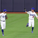 Cody Bellinger shows off ball he caught over the wall that robbed San Diego’s Fernando Tatis of a home run.